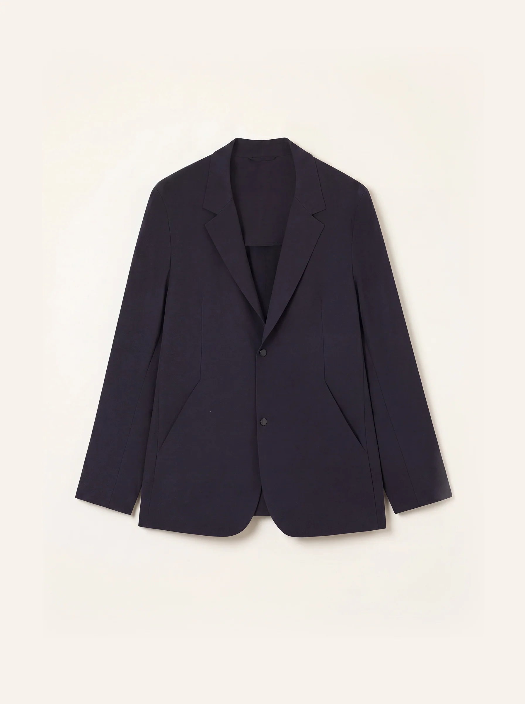 #Deep-Navy_group A dark navy blue blazer jacket with notch lapels and a two-button front, displayed flat against a warm off-white background.