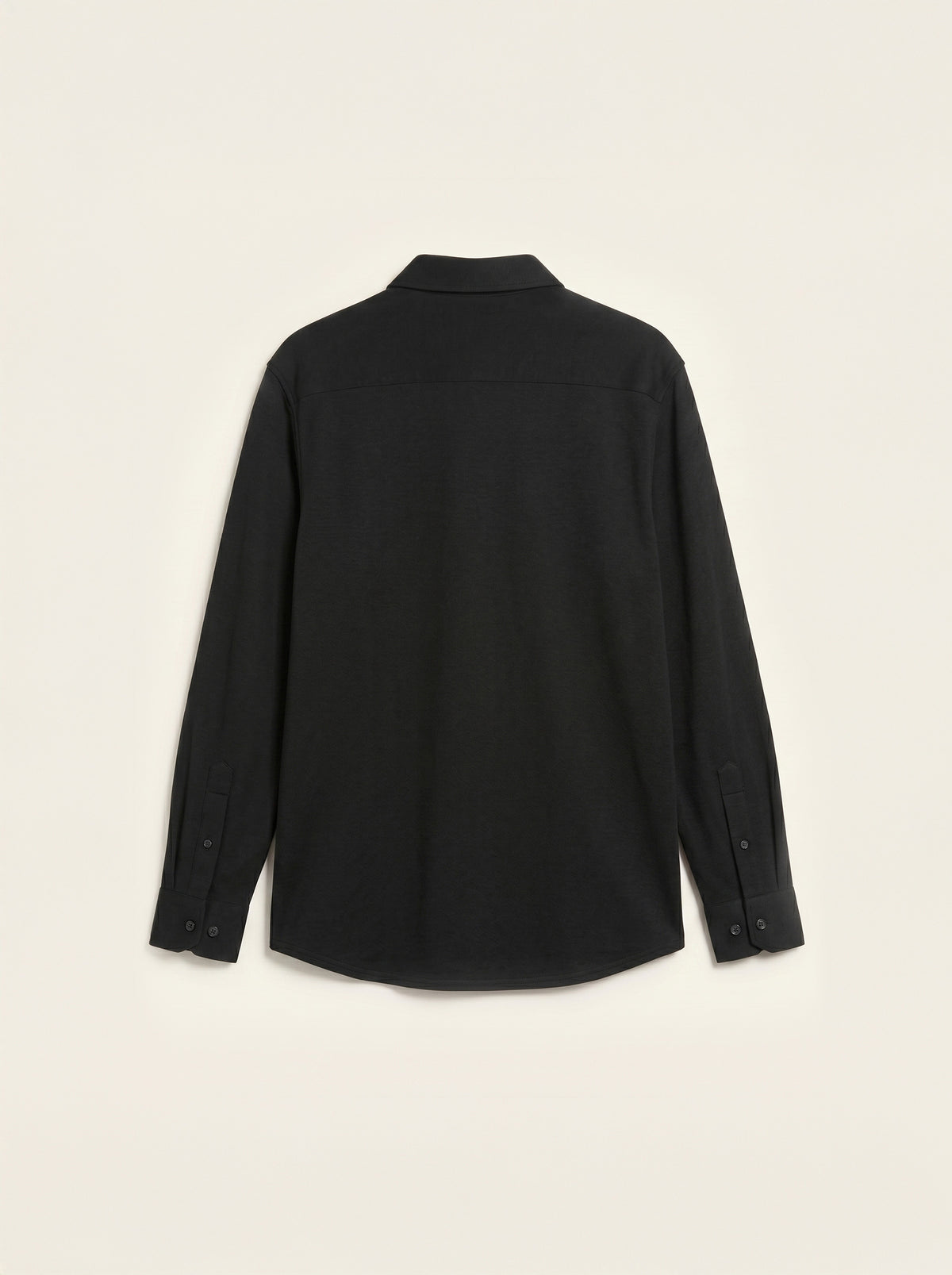 #Jet-Black_group A black long-sleeve button-up shirt shown from the back, laid flat against a light cream background.