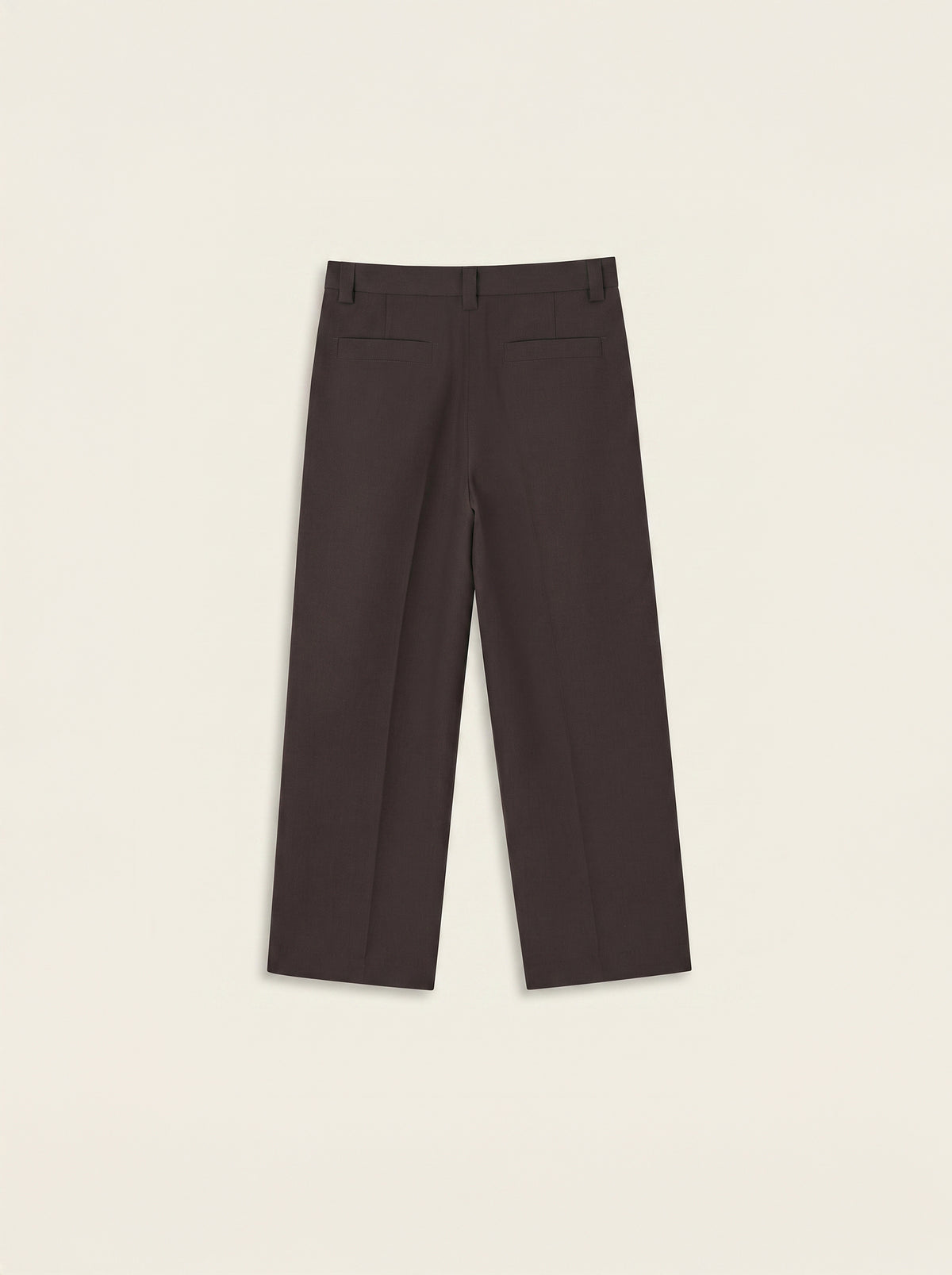 #Cedar-Brown_group A pair of dark brown cropped trousers shown from the back, laid flat on a light beige background.