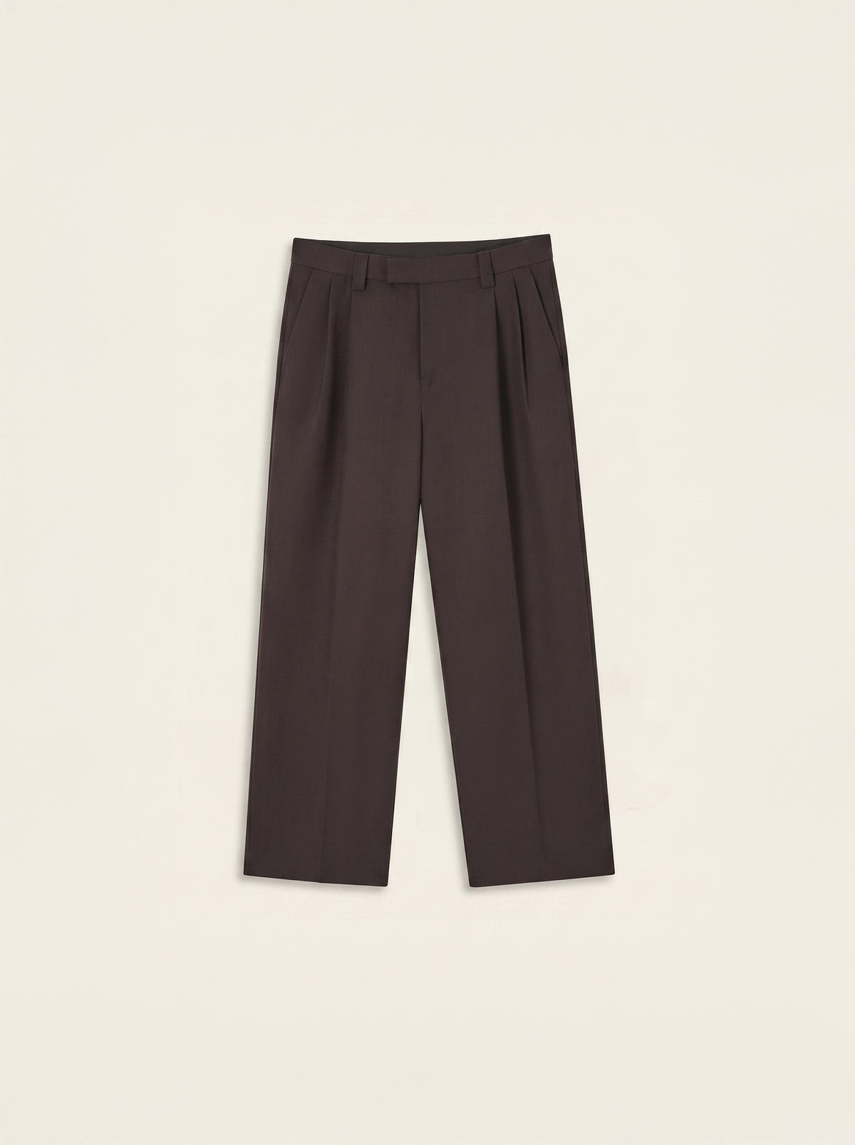 #Cedar-Brown_group Dark brown pleated trousers laid flat against a light cream background.