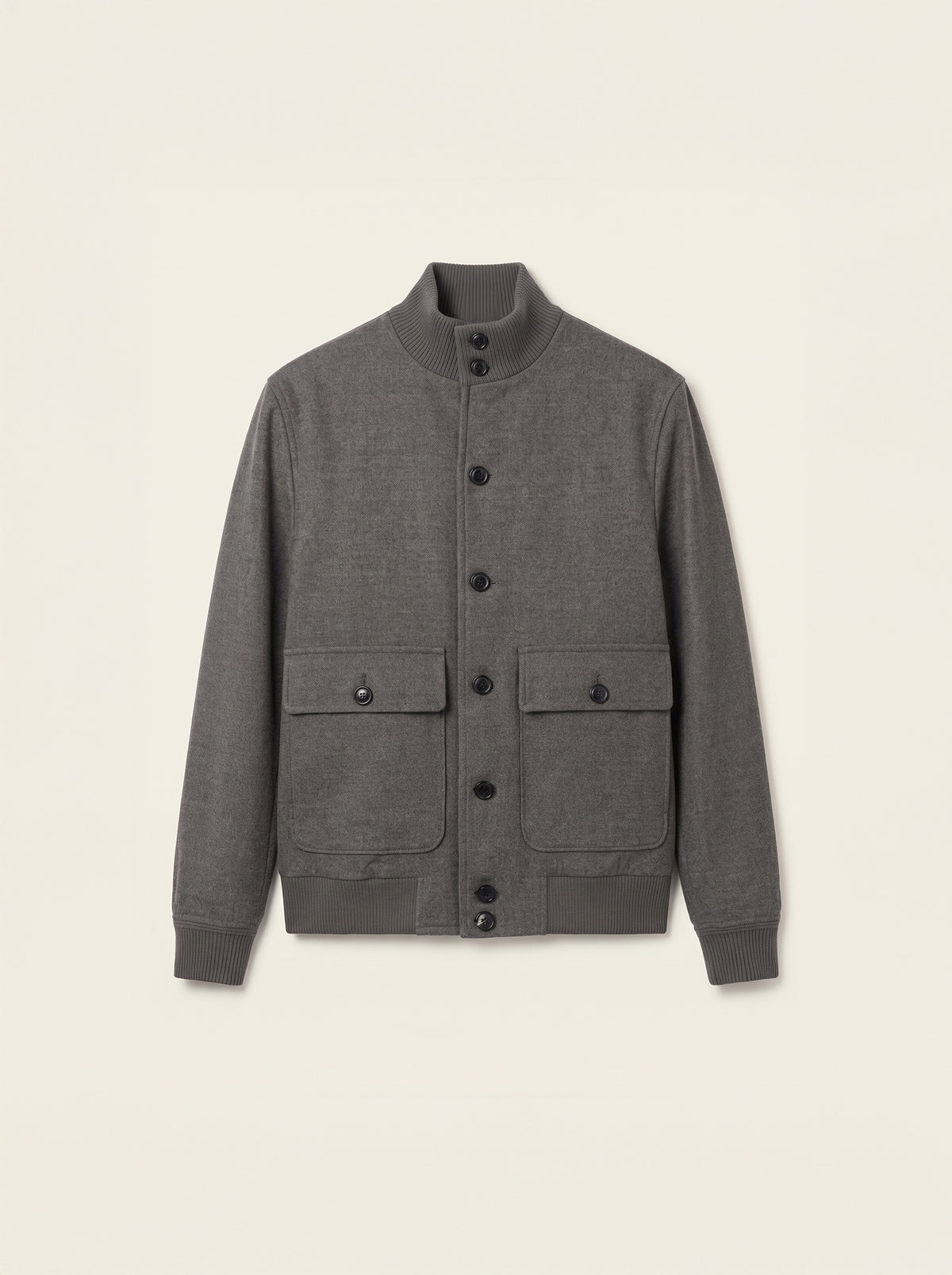 #Charcoal-Grey_group A dark gray heathered wool-blend jacket with a mock neck, snap-button front, and two front flap pockets, displayed flat against a light cream background.