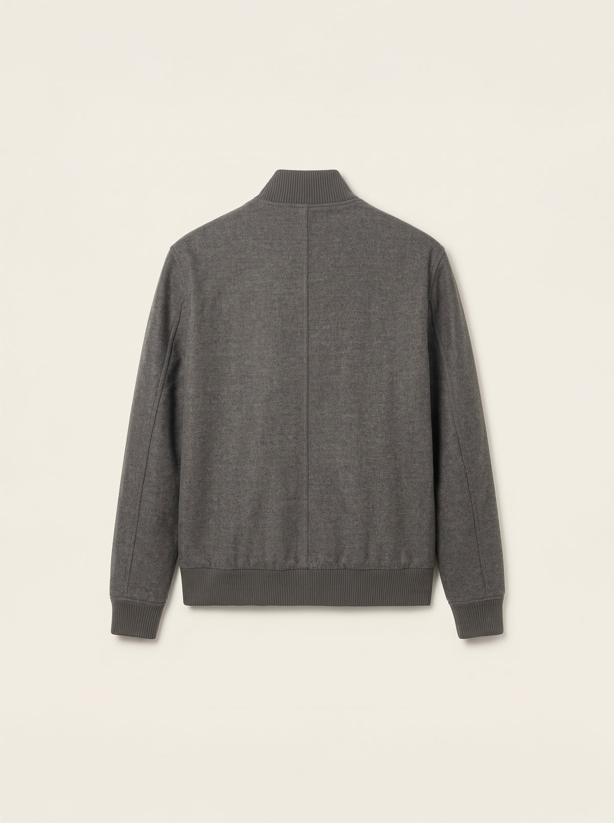 #Charcoal-Grey_group A dark gray heathered knit sweater with a mock neck and ribbed cuffs and hem, shown from the back on a light cream background.