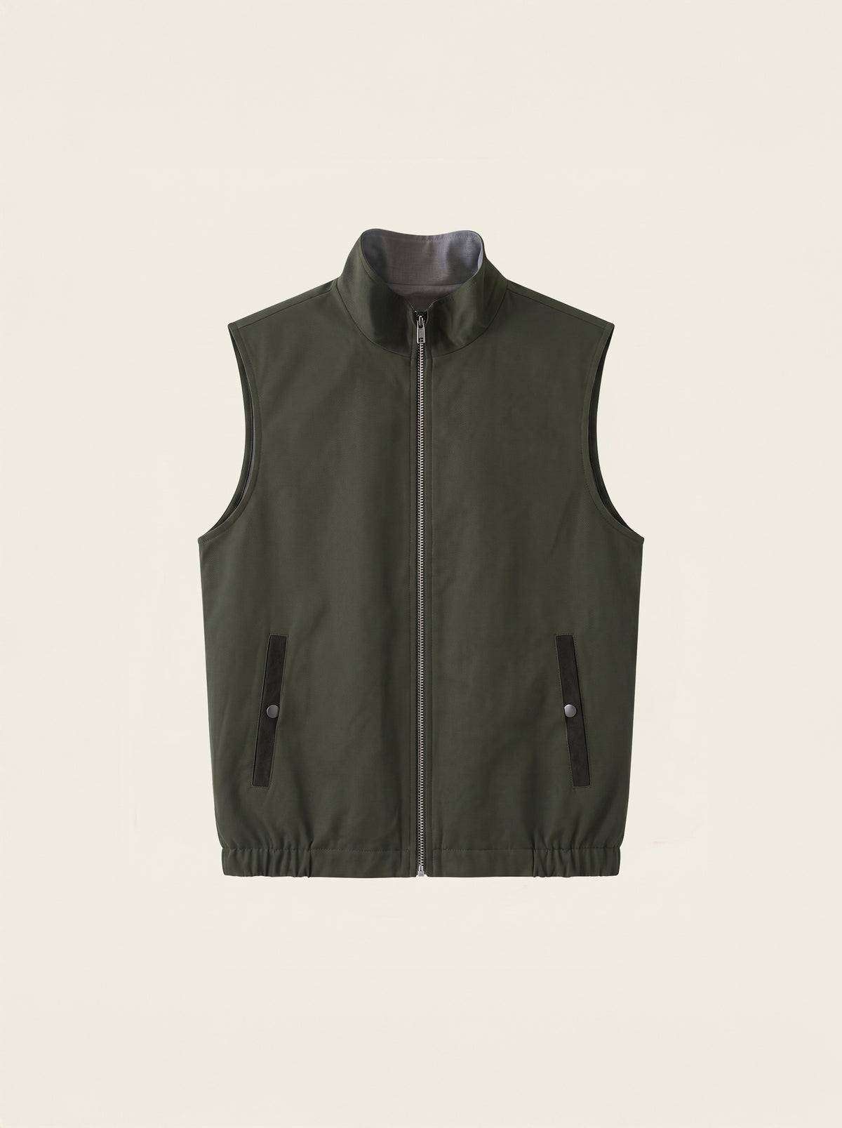 #Olive-Leaf_group An olive green zip-up vest with a stand-up collar and two vertical zippered pockets, displayed flat against a light cream background.