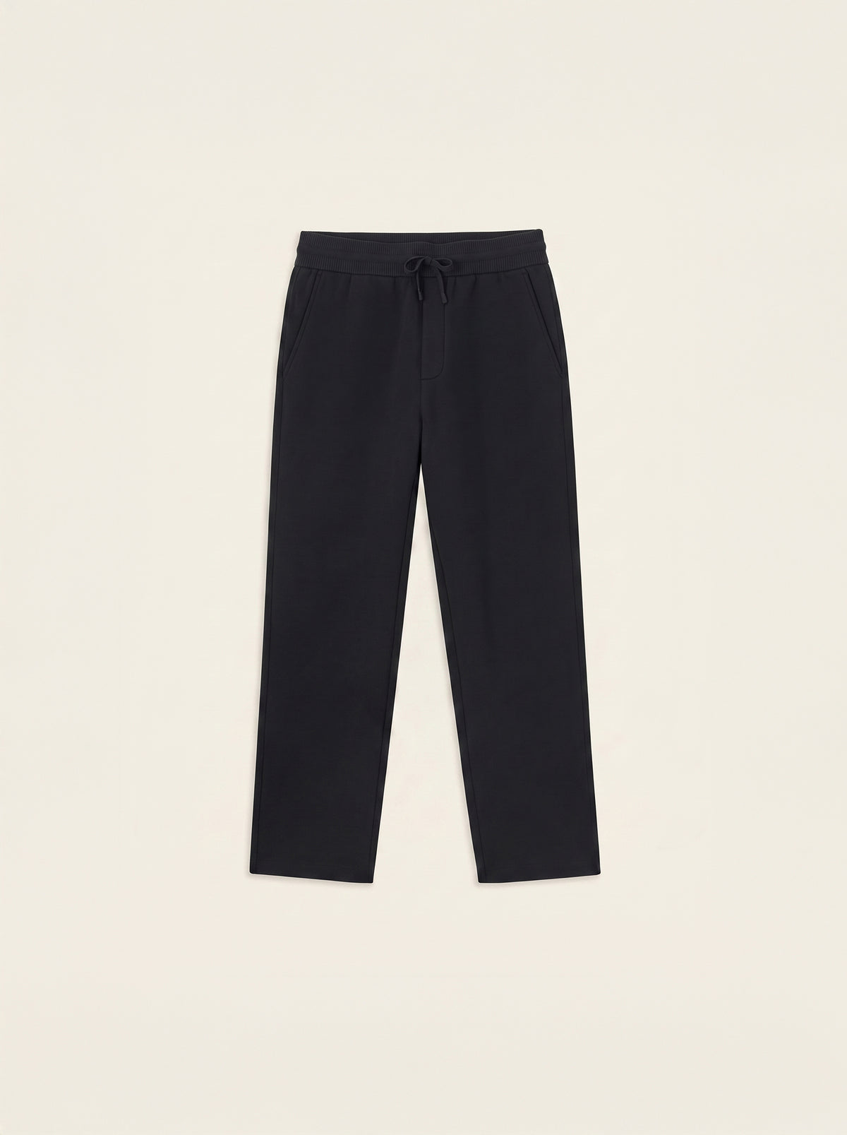 #Jet-Black_group A pair of dark navy blue cropped pants with an elastic waistband and drawstring, laid flat against a light cream background.